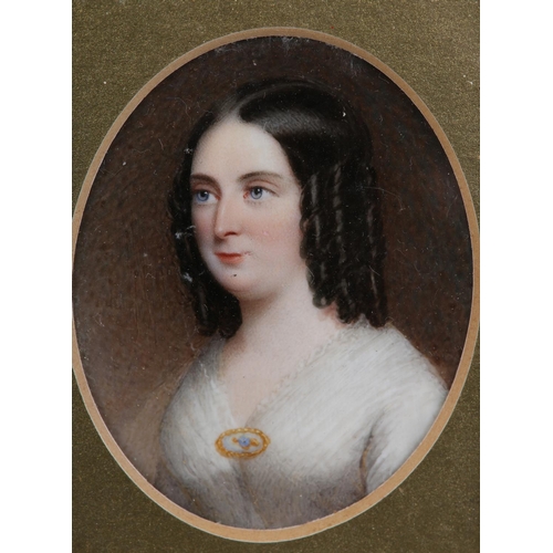 184 - A 19TH CENTURY PORTRAIT MINIATURE OF A LADY, c.1840, head and shoulders, her hair in ringlets, weari... 