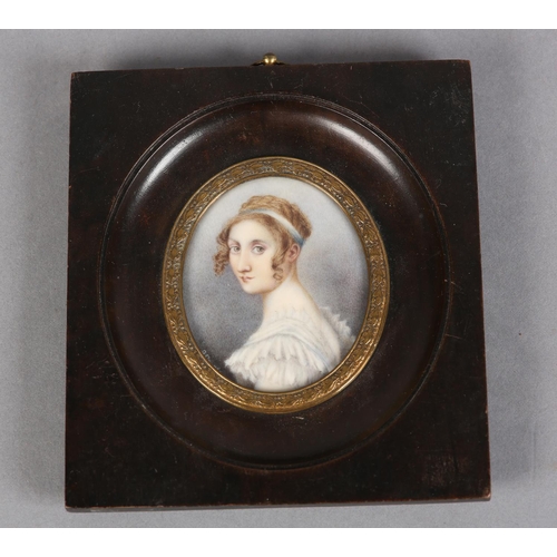 186 - A GOUREAU, AN EARLY 19TH CENTURY PORTRAIT MINIATURE OF A YOUNG LADY, head and shoulders, her hair cu... 