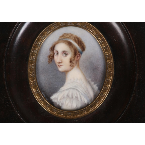 186 - A GOUREAU, AN EARLY 19TH CENTURY PORTRAIT MINIATURE OF A YOUNG LADY, head and shoulders, her hair cu... 