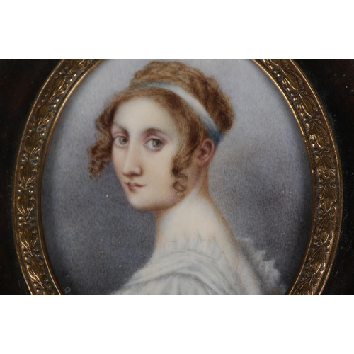 186 - A GOUREAU, AN EARLY 19TH CENTURY PORTRAIT MINIATURE OF A YOUNG LADY, head and shoulders, her hair cu... 