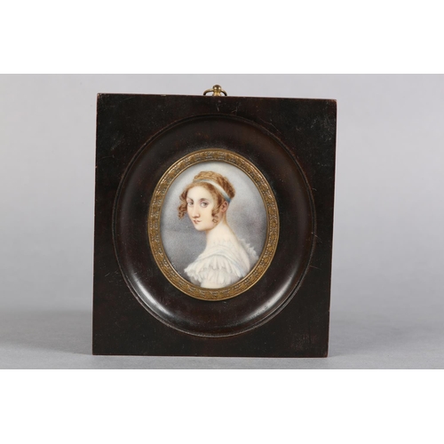 186 - A GOUREAU, AN EARLY 19TH CENTURY PORTRAIT MINIATURE OF A YOUNG LADY, head and shoulders, her hair cu... 