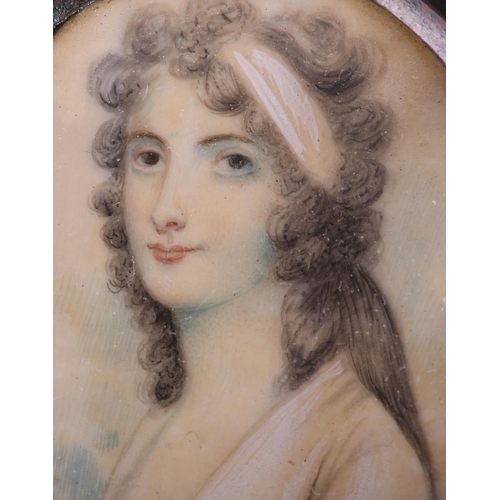 187 - AN EARLY 19TH CENTURY PORTRAIT MINIATURE OF A YOUNG LADY, in Regency dress, her hair caught in a pal... 