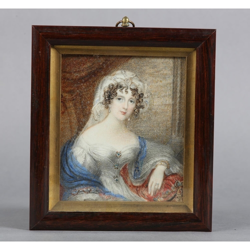 188 - A MID 19TH CENTURY PORTRAIT MINIATURE OF A LADY, half length, wearing a white headdress and gown wit... 