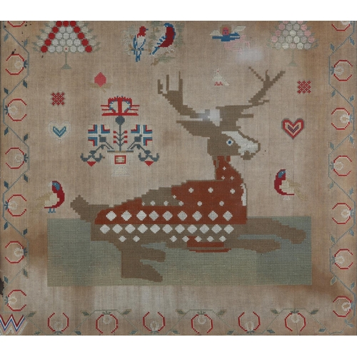 72 - A MID 19TH CENTURY NEEDLEWORK PANEL worked in red, blue, ivory, camel and fox red wools with a recum... 