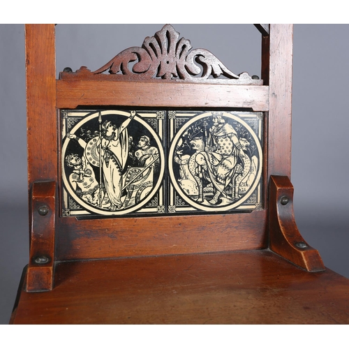 317 - A PAIR OF LATE 19TH CENTURY WALNUT HALL CHAIRS, the arched backs inset with tiles from the Minton Ea... 