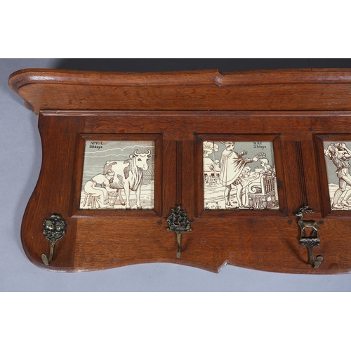 323 - A LATE 19TH CENTURY OAK HALL RACK inset with four tiles representing the months of April 30 days, Ma... 