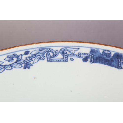 175 - AN 18TH CENTURY CHINESE BLUE AND WHITE BOWL, painted to the exterior with a fort and landscape crane... 