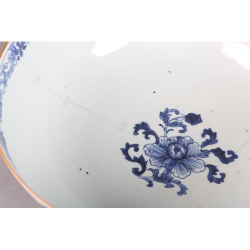 175 - AN 18TH CENTURY CHINESE BLUE AND WHITE BOWL, painted to the exterior with a fort and landscape crane... 