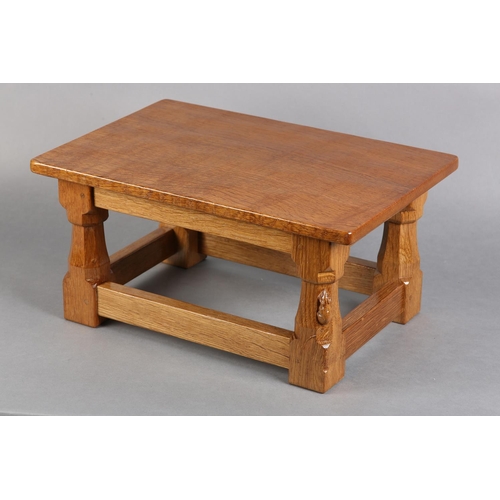 314 - A THOMPSON OF KILBURN OAK FOOTSTOOL, rectangular, an octagonal and square framing, carved in relief ... 