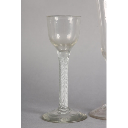 180 - AN 18TH CENTURY WINE GLASS having a drawn bowl on a double-series opaque twist stem on conical foot,... 