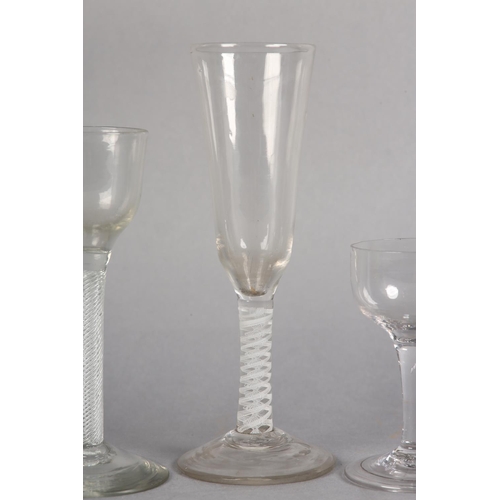 180 - AN 18TH CENTURY WINE GLASS having a drawn bowl on a double-series opaque twist stem on conical foot,... 