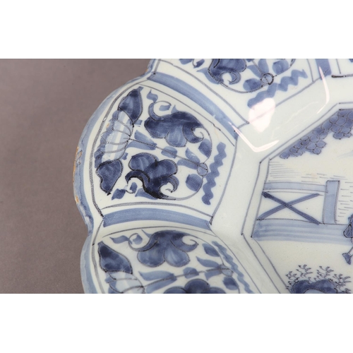 160 - AN 18TH CENTURY DUTCH DELFT LOBED DISH, painted in the chinoiserie manner with an elegant figure and... 