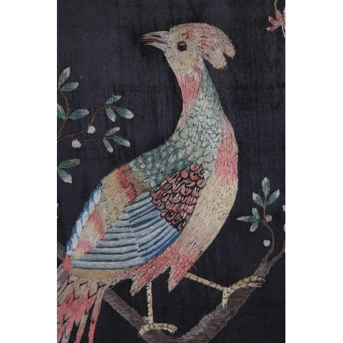 75 - A GEORGE III/IV SILK EMBROIDERY of an exotic bird of colourful plumage, perched in a blossom tree wi... 