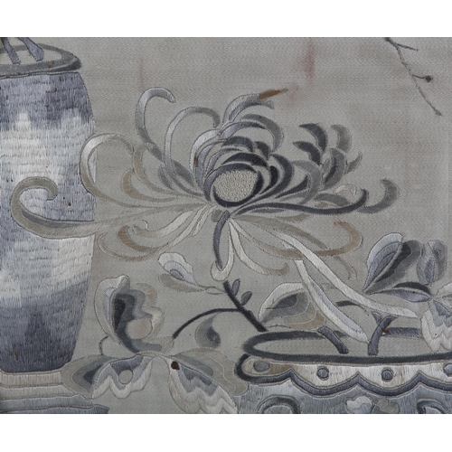 177 - A 19TH CENTURY CHINESE SILK EMBROIDERY in shades of grey and ivory worked with a vase of honeysuckle... 