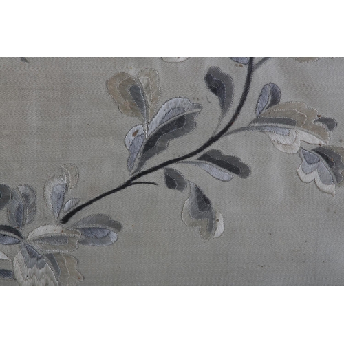 177 - A 19TH CENTURY CHINESE SILK EMBROIDERY in shades of grey and ivory worked with a vase of honeysuckle... 