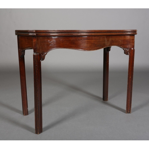 343 - AN 18TH CENTURY MAHOGANY CARD TABLE of serpentine outline, the fold-over top lined in baise, above a... 