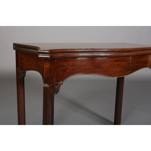 343 - AN 18TH CENTURY MAHOGANY CARD TABLE of serpentine outline, the fold-over top lined in baise, above a... 