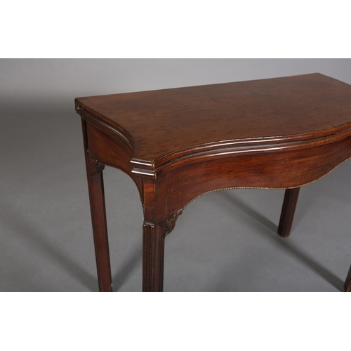 343 - AN 18TH CENTURY MAHOGANY CARD TABLE of serpentine outline, the fold-over top lined in baise, above a... 