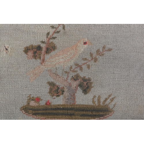 76 - A 19TH CENTURY NEEDLEWORK PANEL worked in pale blue/green, olive green, ivory and coral wool with a ... 