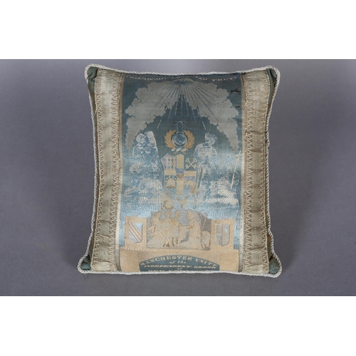 78 - A 19TH CENTURY WOVEN SILK CUSHION, small, pale turquoise and gold,  bearing the symbols and blazon o... 