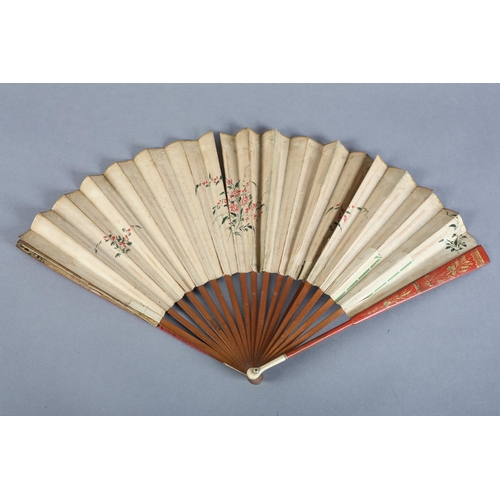 1 - Two late 18th century fans, the first with slender wood monture, the guards painted red and gilded, ... 