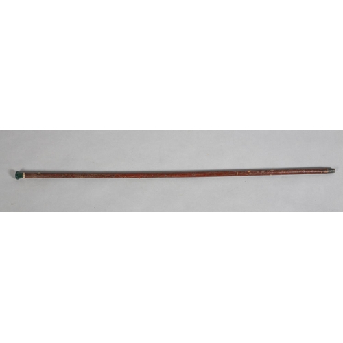 111 - A LATE 19TH CENTURY HARDSTONE TOPPED WALKING CANE, the faceted and turn bloodstone top set in a 9ct ... 