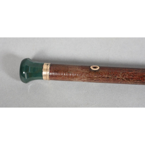 111 - A LATE 19TH CENTURY HARDSTONE TOPPED WALKING CANE, the faceted and turn bloodstone top set in a 9ct ... 