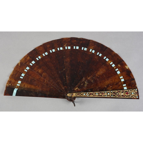 12 - A good tortoiseshell brisé fan, eighteen inner sticks and two guards, both guards adorned with gold ... 