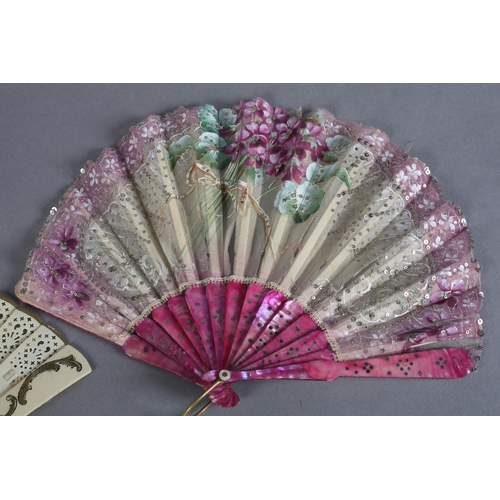 16 - A very feminine early 20th century gauze fan in fontange form, the mother of pearl monture dyed ceri... 