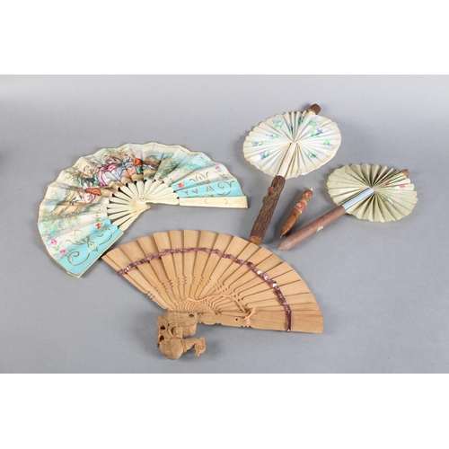 17 - Novelty fans: a mid-19th century bone telescopic fan, the double paper leaf lithographed in fresh co... 