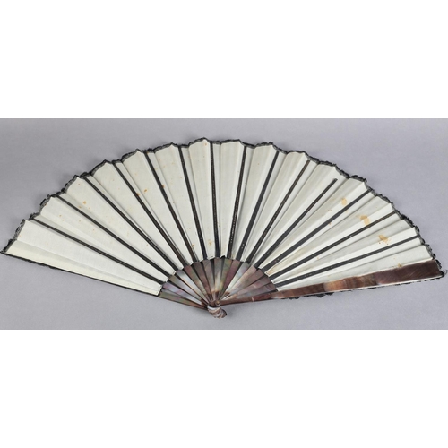 22 - A good late 19th century fan, the monture of Tahiti pearl, the leaf of black machine lace with a flo... 