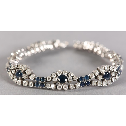 254 - A SAPPHIRE AND DIAMOND BRACELET, claw set with brilliant cut diamonds and circular faceted sapphires... 