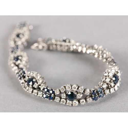 254 - A SAPPHIRE AND DIAMOND BRACELET, claw set with brilliant cut diamonds and circular faceted sapphires... 