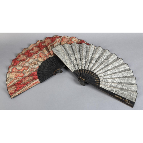 26 - C 1880's, two fans with black wood montures, the first mounted with a fabric leaf printed in the sty... 