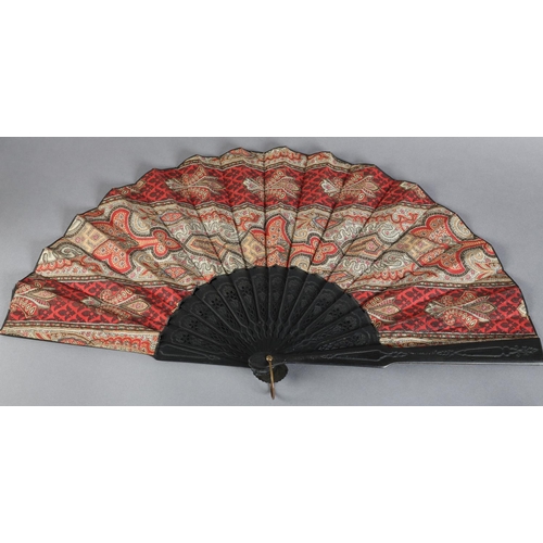 26 - C 1880's, two fans with black wood montures, the first mounted with a fabric leaf printed in the sty... 