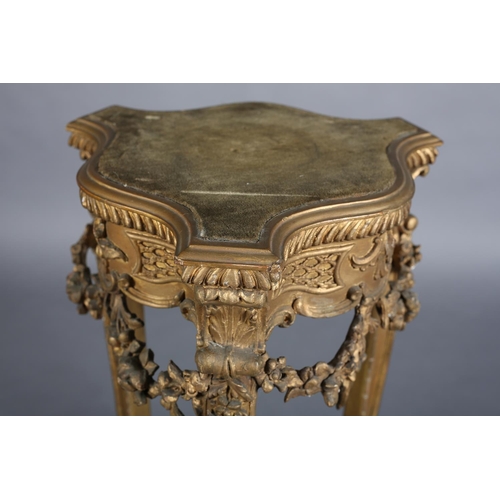 359 - A LATE 19TH CENTURY GILTWOOD AND GESSO URN STAND of serpentine tripod outline with gadroon rim, velv... 