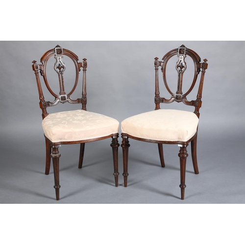 360 - A PAIR OF VICTORIAN WALNUT SALON CHAIRS having an open oval back, upholstered seat on turned and flu... 