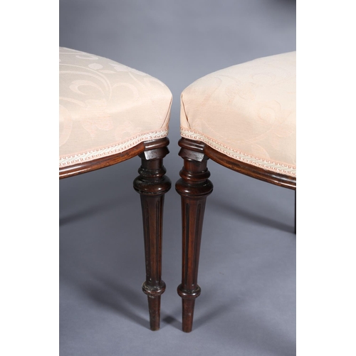 360 - A PAIR OF VICTORIAN WALNUT SALON CHAIRS having an open oval back, upholstered seat on turned and flu... 