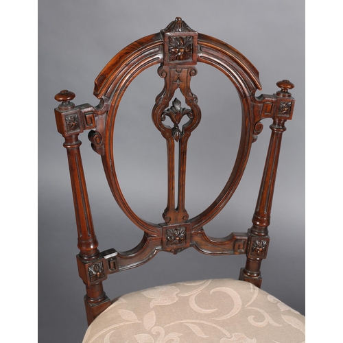 360 - A PAIR OF VICTORIAN WALNUT SALON CHAIRS having an open oval back, upholstered seat on turned and flu... 