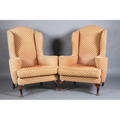 366 - A PAIR OF GEORGE III STYLE WINGED ARMCHAIRS having an arched back, outward scrolled arms and on shor... 