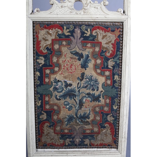 369 - A VICTORIAN CREAM PAINTED FIRE SCREEN with arched and pierced cresting carved with 'C' scrolls and l... 