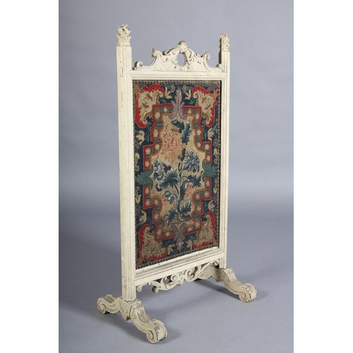 369 - A VICTORIAN CREAM PAINTED FIRE SCREEN with arched and pierced cresting carved with 'C' scrolls and l... 