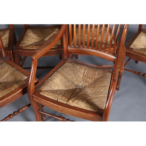 382 - A SET OF SEVEN LATE 19TH CENTURY WALNUT RAIL BACK DINING CHAIRS with rush seats, on stylised cabriol... 