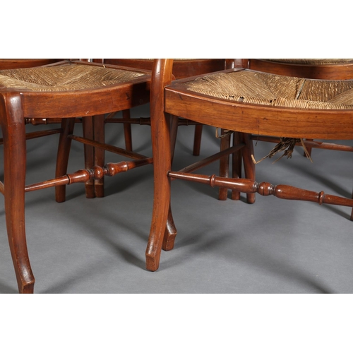 382 - A SET OF SEVEN LATE 19TH CENTURY WALNUT RAIL BACK DINING CHAIRS with rush seats, on stylised cabriol... 