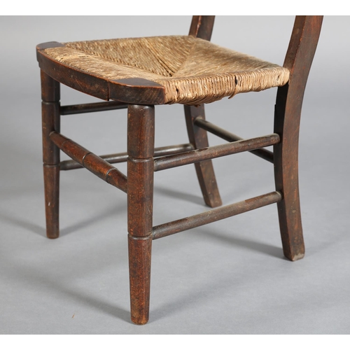 385 - A 19TH CENTURY CHILD'S POLISHED BEECH CHAIR, having a bar top rail and triple spindle back, rush sea... 