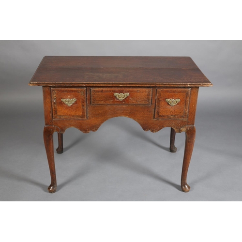 387 - AN GEORGE III ELM AND MAHOGANY BANDED SIDE TABLE, having three drawers with brass back plates and sw... 