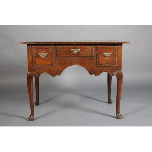 387 - AN GEORGE III ELM AND MAHOGANY BANDED SIDE TABLE, having three drawers with brass back plates and sw... 