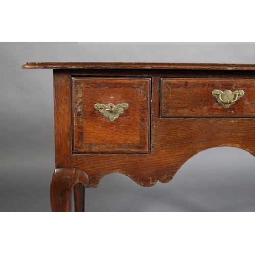 387 - AN GEORGE III ELM AND MAHOGANY BANDED SIDE TABLE, having three drawers with brass back plates and sw... 