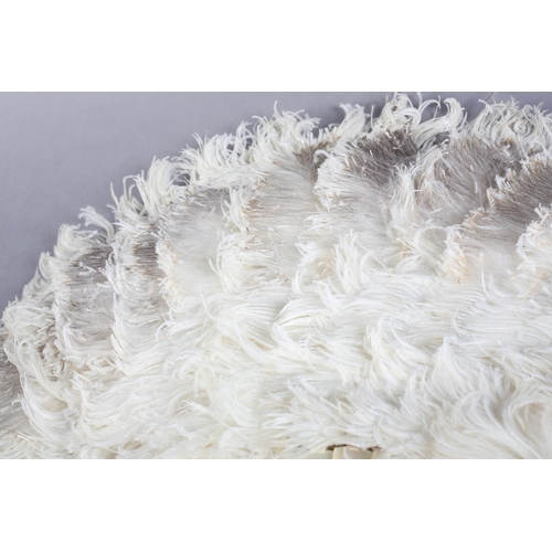 46 - A cream feather fan c 1900, ostrich and possibly marabou, or simply shaved to give a light and fluff... 