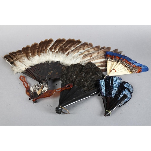 47 - Five feather fans: a small, shaped, Jay feather fan mounted on tortoiseshell, overall height approx.... 